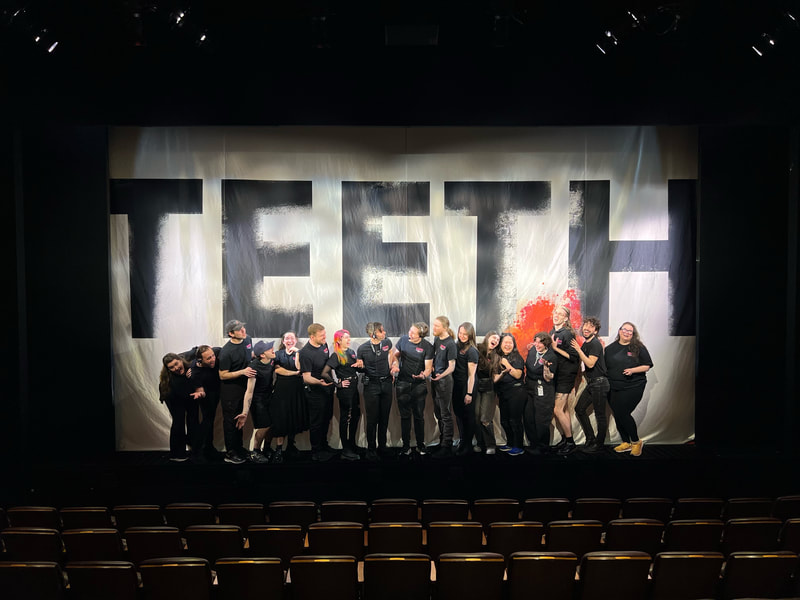 Crew of Teeth posing on stage for a picture. 